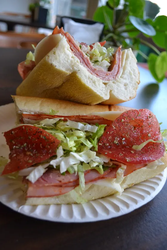 An Italian hoagie sliced and plated